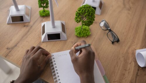 close-up-man-writing-notebook