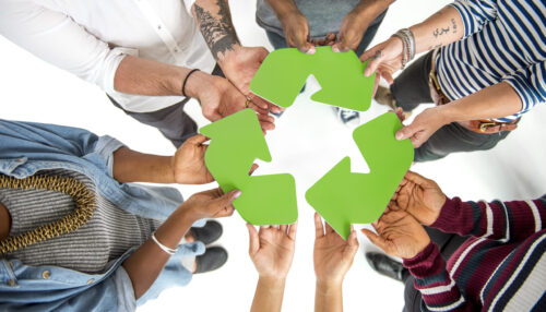 Group of People Holding Recycling Sign Concept